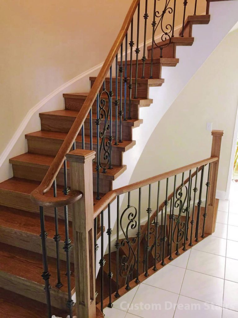 straight wooden stairs with steel railing in brown color